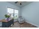 Comfortable home office or flex space with chair, desk, and natural light, perfect for work or relaxation at 6176 Wilkes Pond Dr, Hollywood, SC 29449