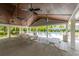 Open-air pavilion offers picnic tables and ceiling fans, creating a comfortable gathering spot near the pool and amenities at 6176 Wilkes Pond Dr, Hollywood, SC 29449