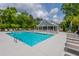 A luxurious community pool with ample seating and a covered pavilion for relaxing poolside enjoyment at 6176 Wilkes Pond Dr, Hollywood, SC 29449