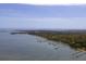 Breathtaking aerial view showcases waterfront homes with private docks along a lush, green coastline at 679 Clearview Dr, Charleston, SC 29412