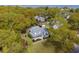 An aerial view of a charming home surrounded by mature trees and lush landscaping, near a body of water at 679 Clearview Dr, Charleston, SC 29412