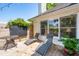 Inviting back patio features stylish furniture, ambient string lights and a charming, well-maintained garden area at 679 Clearview Dr, Charleston, SC 29412