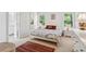 Bright bedroom with two windows, hardwood floors, a queen bed and white dressers at 679 Clearview Dr, Charleston, SC 29412
