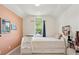 Charming bedroom with built in drawers under the bed frame and bright window at 679 Clearview Dr, Charleston, SC 29412