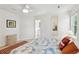 Well-lit bedroom with a bed, carpet, and a basket with a large print on the wall at 679 Clearview Dr, Charleston, SC 29412