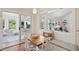 The dining area features a wooden table with seating and a window seat with backyard views at 679 Clearview Dr, Charleston, SC 29412