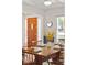 Dining room featuring a wood front door, natural light, wood table, and seating for four at 679 Clearview Dr, Charleston, SC 29412