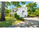 Well maintained home showcasing a driveway, basketball hoop, and mature landscaping at 679 Clearview Dr, Charleston, SC 29412