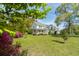Beautiful two-story home with well-kept lawn, mature trees, and beautiful landscaping and inviting front porch at 679 Clearview Dr, Charleston, SC 29412
