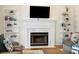 Cozy fireplace with a decorative mantel and built-in shelves creates a warm and inviting living space at 679 Clearview Dr, Charleston, SC 29412