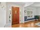 Bright and welcoming foyer featuring a hardwood floor, wood door, and crisp, white trim at 679 Clearview Dr, Charleston, SC 29412