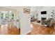 Charming living room seamlessly connects to a dining area and features hardwood floors and a bright ambiance at 679 Clearview Dr, Charleston, SC 29412