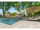 A luxurious in-ground swimming pool with a surrounding patio area and comfortable lounge chairs at 679 Clearview Dr, Charleston, SC 29412