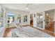 The sunroom has a ceiling fan, hardwood floors, and plenty of natural light from the windows and sliding doors at 679 Clearview Dr, Charleston, SC 29412