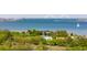 Panoramic waterfront view features lush greenery and trees with a bridge in the distance at 679 Clearview Dr, Charleston, SC 29412