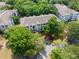 Aerial view of condo buildings surrounded by lush trees, showcasing the community's well-maintained landscaping at 700 Daniel Ellis Dr # 4104, Charleston, SC 29412