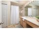 Bright bathroom featuring a shower-tub combination, large mirror, and spacious vanity with ample counter space at 700 Daniel Ellis Dr # 4104, Charleston, SC 29412