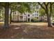 Building exterior framed by large trees and featuring multiple balconies at 700 Daniel Ellis Dr # 4104, Charleston, SC 29412