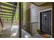 Charming apartment entrance with outdoor stairs and a lovely potted flower arrangement by the front door at 700 Daniel Ellis Dr # 4104, Charleston, SC 29412