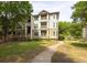 Multi-story building with well-maintained lawn at 700 Daniel Ellis Dr # 4104, Charleston, SC 29412