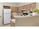 Bright kitchen with white appliances, light wood cabinets, and breakfast bar at 700 Daniel Ellis Dr # 4104, Charleston, SC 29412