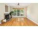 Inviting living room offers hardwood floors, a ceiling fan, and cozy fireplace at 700 Daniel Ellis Dr # 4104, Charleston, SC 29412