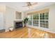 Open living room features hardwood floors, fireplace, ceiling fan, and natural light at 700 Daniel Ellis Dr # 4104, Charleston, SC 29412