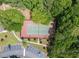 Overhead view of a tennis court with surrounding trees and parking at 700 Daniel Ellis Dr # 4104, Charleston, SC 29412