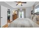 Comfortable bedroom with a ceiling fan, hardwood floors, and ample natural light at 71 Cypress St, Charleston, SC 29403