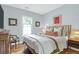 Comfortable bedroom featuring a light blue color palette and hardwood floors at 71 Cypress St, Charleston, SC 29403
