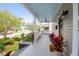 Cozy front porch featuring a fan, hanging swing, wreath, and fresh plants at 71 Cypress St, Charleston, SC 29403