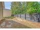 Spacious backyard area featuring a privacy fence and a combination of grass and mulch ground cover at 7414 Purser Ln, Hanahan, SC 29410