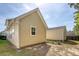 This backyard features neutral siding, a well-kept lawn, and a matching shed for extra storage and curb appeal at 7414 Purser Ln, Hanahan, SC 29410