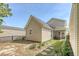 This backyard features neutral siding, a well-kept lawn, a matching shed, and a screened-in porch at 7414 Purser Ln, Hanahan, SC 29410