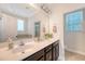 Bathroom with double vanity, large mirrors, and modern fixtures at 7414 Purser Ln, Hanahan, SC 29410
