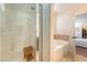 Bathroom with walk-in shower and tub, featuring tiled accents at 7414 Purser Ln, Hanahan, SC 29410