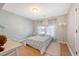 Bright bedroom features a full bed, shiplap wall, and large windows at 7414 Purser Ln, Hanahan, SC 29410