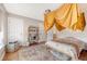 Cozy bedroom with lots of natural light, rug, and a bookshelf at 7414 Purser Ln, Hanahan, SC 29410