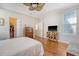 Spacious bedroom with hardwood flooring, large windows, and access to a closet at 7414 Purser Ln, Hanahan, SC 29410