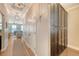 Well-lit hallway leading to the living area featuring ample storage cabinets and hardwood floors at 7414 Purser Ln, Hanahan, SC 29410