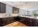 Well-designed kitchen boasts ample counter space, dark cabinets, and modern appliances, perfect for cooking at 7414 Purser Ln, Hanahan, SC 29410
