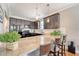 Bright kitchen with granite counters, pendant lighting, and stainless steel appliances provides ample workspace at 7414 Purser Ln, Hanahan, SC 29410