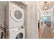 Convenient laundry area with modern stacked washer and dryer provides efficient space-saving functionality at 7414 Purser Ln, Hanahan, SC 29410
