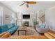 Cozy living room with fireplace, built-in shelving, hardwood floors, and comfortable seating, perfect for relaxation and gatherings at 7414 Purser Ln, Hanahan, SC 29410