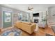Comfortable living room featuring a fireplace, built-in shelving, and hardwood floors, creating a cozy and inviting atmosphere at 7414 Purser Ln, Hanahan, SC 29410