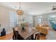 Inviting living room features hardwood floors, neutral walls, and a light-filled ambiance from the windows at 7414 Purser Ln, Hanahan, SC 29410