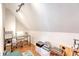 Attic converted into an office space with a desk, chair, storage, and hardwood floors at 7414 Purser Ln, Hanahan, SC 29410