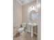 Cozy half-bathroom with a pedestal sink, tiled flooring, and updated fixtures at 7477 Painted Bunting Way, Hanahan, SC 29410
