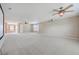 Large, expansive bonus room featuring high ceilings, multiple ceiling fans, and a projector at 7477 Painted Bunting Way, Hanahan, SC 29410