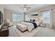 Beautifully staged main bedroom with accent wall, providing a bright and elegant space at 7477 Painted Bunting Way, Hanahan, SC 29410